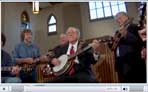 Earl Scruggs, Sam Bush, Ricky Skaggs and Phil Leadbetter play Jingle Bells for Gibson